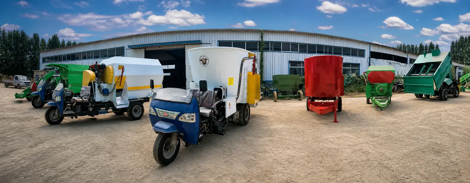 TMR feed mixers and agricultural machinery lined up outside the Anlan factory